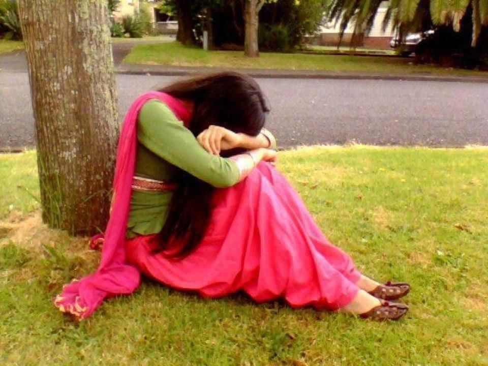 sad girl near tree
